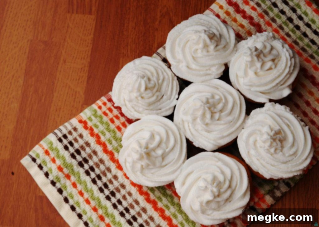 A beautiful grouping of various desserts topped with vegan vanilla frosting