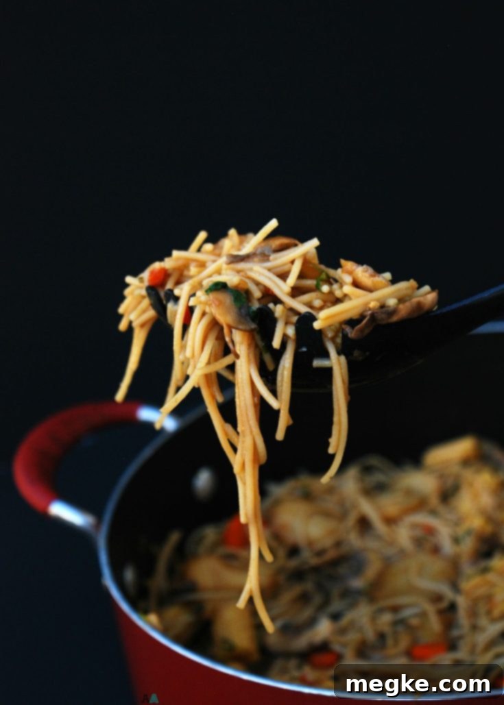 Gluten-Free Lo Mein with fresh ingredients on a wooden board
