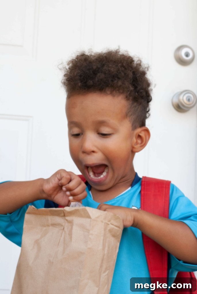 Beyond the Lunchbox: Allergy-Safe School Meals & Seamless School Support 6 Child excited to open their allergy-friendly school lunch