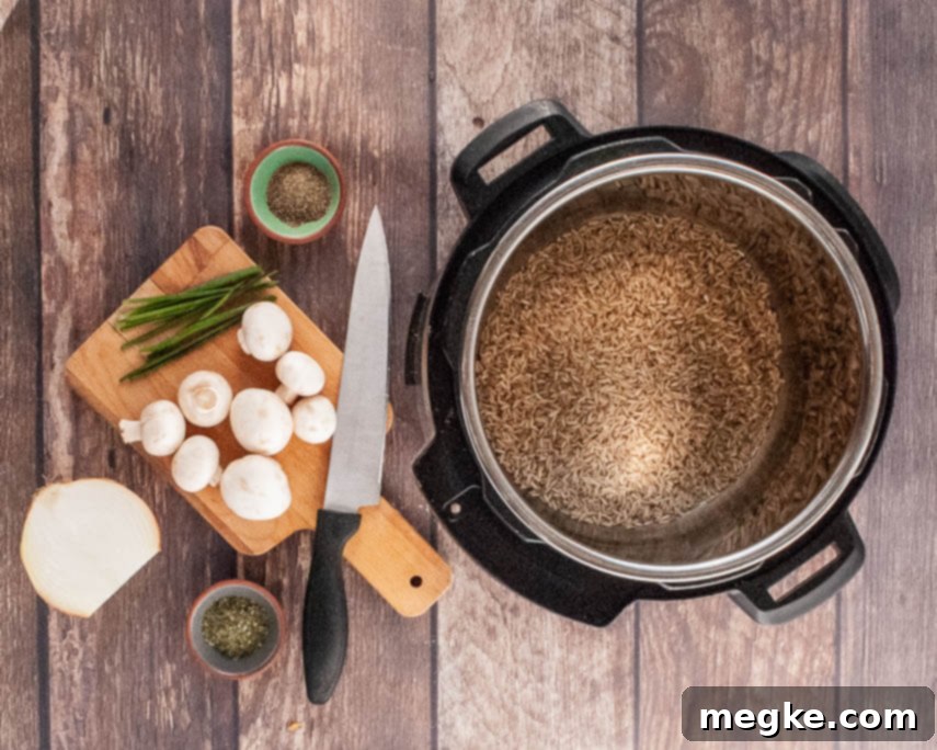 Ingredients for Instant Pot Mushroom Rice Pilaf laid out on a cutting board