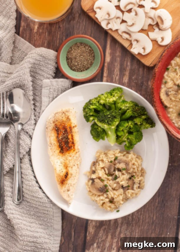 A bowl of gluten-free Instant Pot Mushroom Rice Pilaf, garnished with fresh herbs