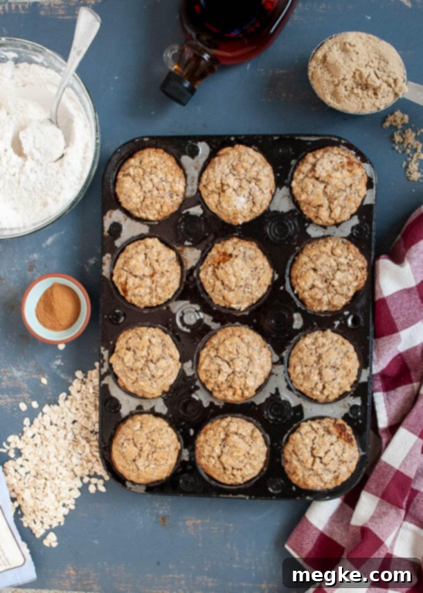 A close-up shot of several golden brown sugar oatmeal muffins, perfectly baked and ready to be enjoyed.