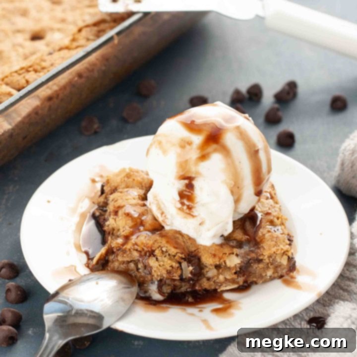 Indulgent Gluten Free Vegan Oatmeal Chocolate Chip Bars 6 gluten-free-vegan-oatmeal-chocolate-chip-bars on a plate with ice cream