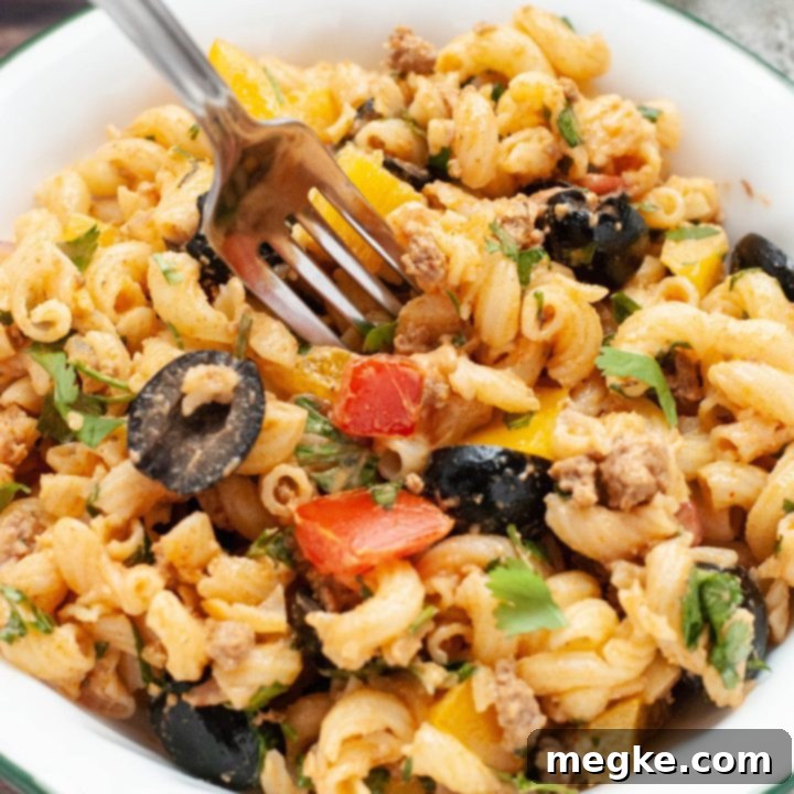 Dairy-Free Taco Pasta Salad 6 Taco Pasta Salad with a creamy dressing, ground turkey, and fresh vegetables