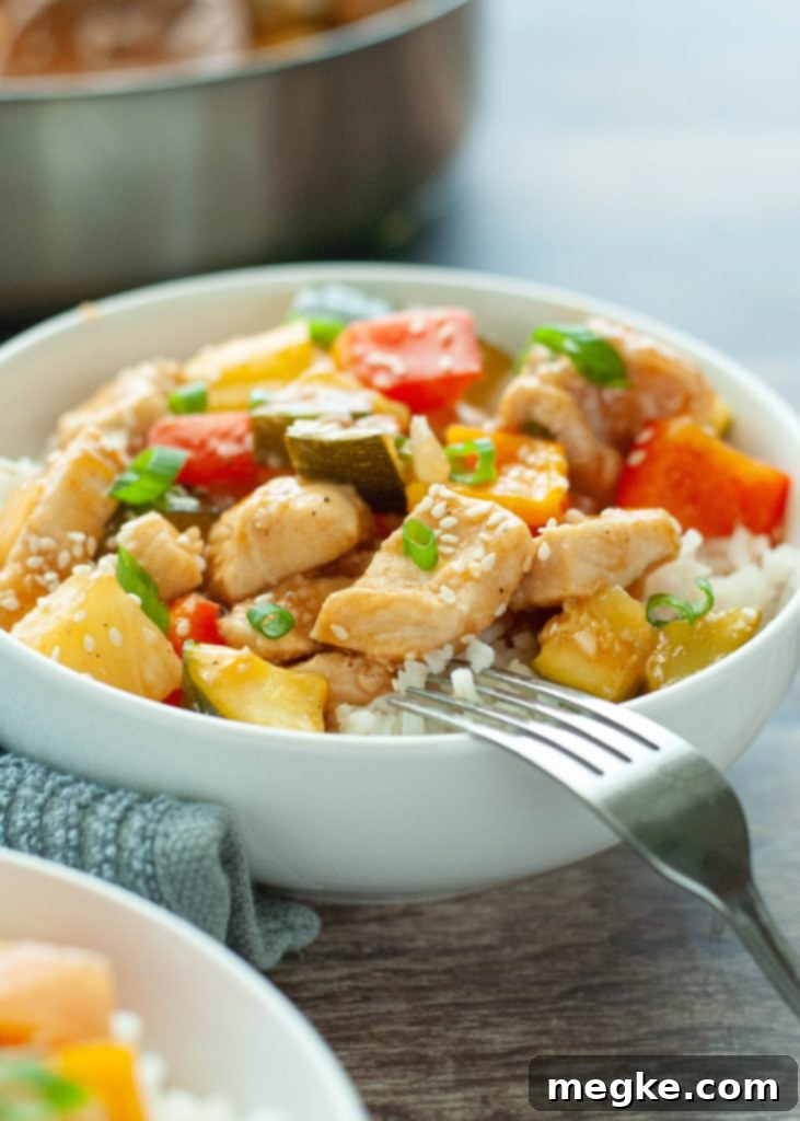 Delicious Homemade Sweet and Sour Chicken Stir Fry with vibrant vegetables over rice