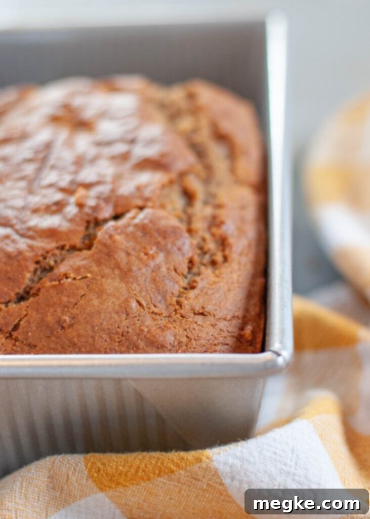 Perfect Gluten Free Banana Bread Visual Recipe 4 Sliced gluten-free dairy-free banana bread on a cooling rack, showing its moist interior.