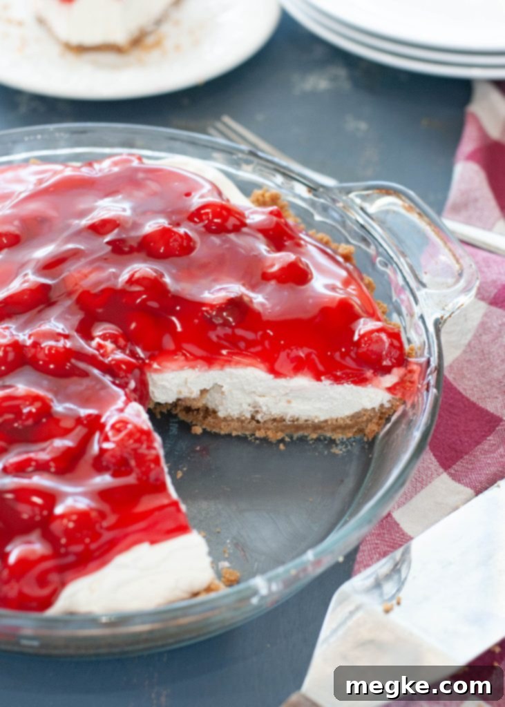 Indulgent No-Bake Cherry Cheesecake Dairy-Free and Gluten-Free 2 no bake cherry cheesecake with slice taken out, showcasing creamy filling and cherry topping
