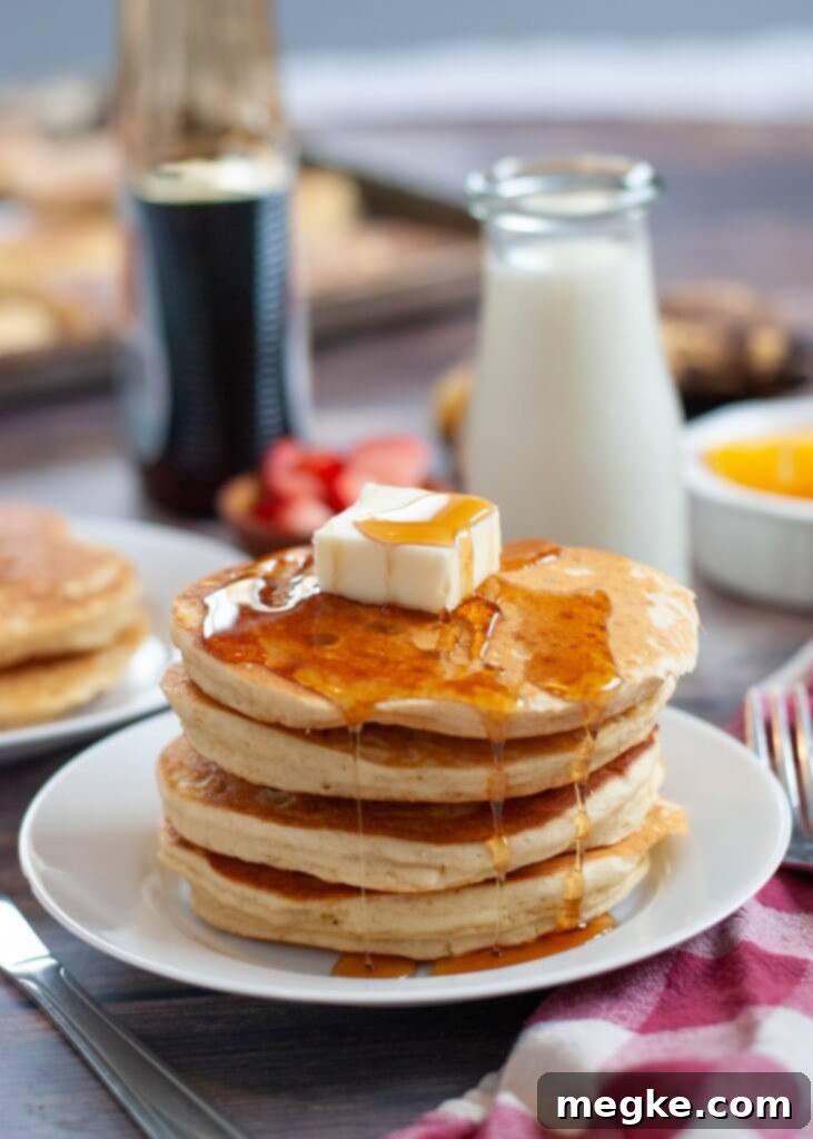Simple Gluten Free Pancakes 10 easy-gluten-free-pancakes - stacks of golden brown, fluffy gluten-free pancakes topped with syrup