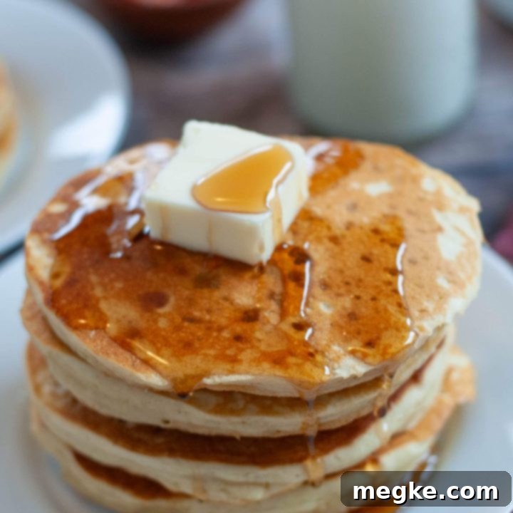 Simple Gluten Free Pancakes 7 what-flour-to-use-in-gluten-free-pancakes - stacks of golden brown, fluffy gluten-free pancakes topped with syrup