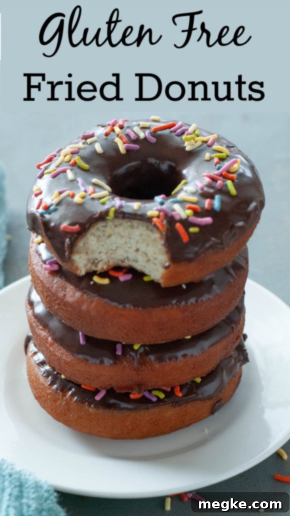 Gluten-Free Doughnuts Recipe with Video 8 Stacked gluten-free donuts with a bite taken out – ideal Pinterest image for a gluten-free donut recipe