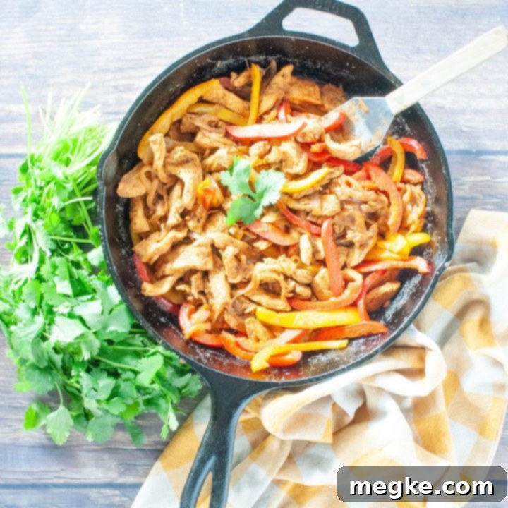 Foolproof Fajita Chicken Marinade 7 overhead-shot-of-chicken-fajitas-in-cast-iron-skillet