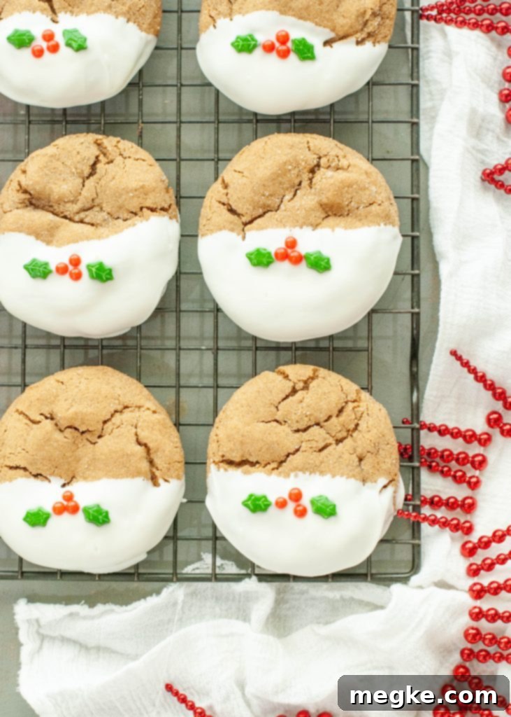 gluten-free-gingerbread-cookies-with-holly-berry-sprinkles-on-a-cooling-rack
