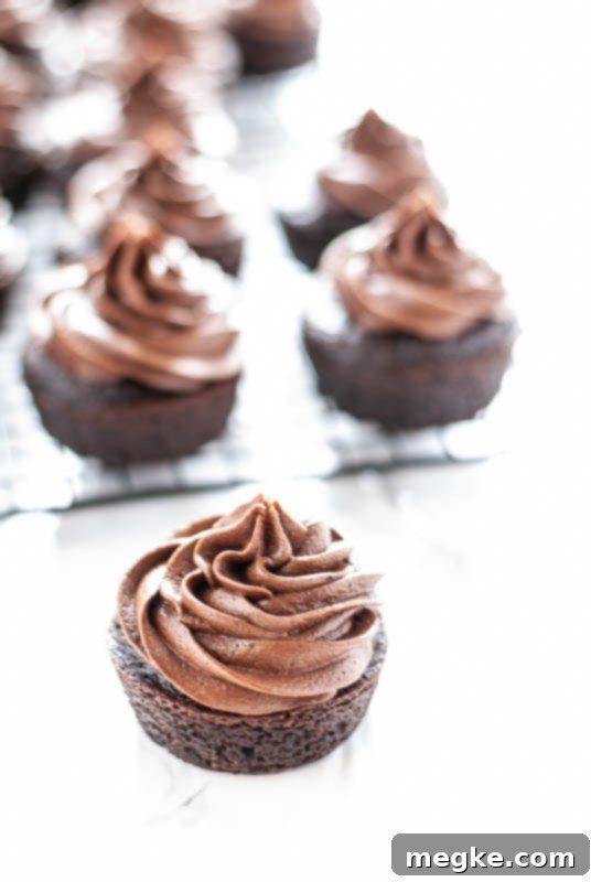 Creamy dairy-free chocolate frosting spread on a cake slice